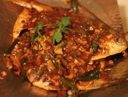 Fried whole pomfret with hot sauce