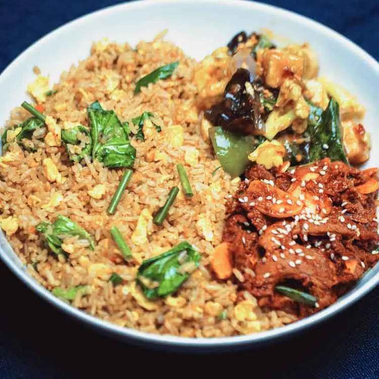 Ginger Chicken Rice Bowl Egg Fried Rice Served with Soy Glazed Ginger Chicken, Mushroom & Baby Corn