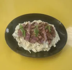Signature Rib-Eye Alfredo Pasta
