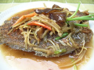 Sliced fish with ginger & basil leaf