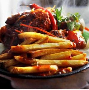 Steamed fish on sizzler with sauce