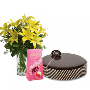 chocolate-mud-cake-with-yellow-lilies-lindt-strawberry-chocolates