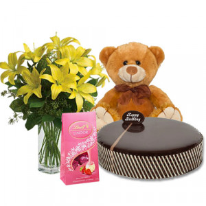 chocolate-mud-cake-with-yellow-lilies-lindt-strawberry-chocolates-8-inch-teddy
