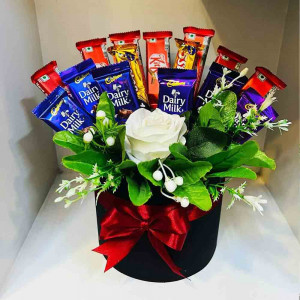 Kit Kat and Dairy Milk with artificial flower